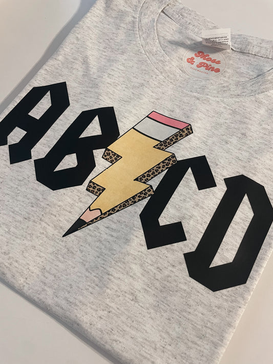 ABCD Teacher Pencil Bolt Tee